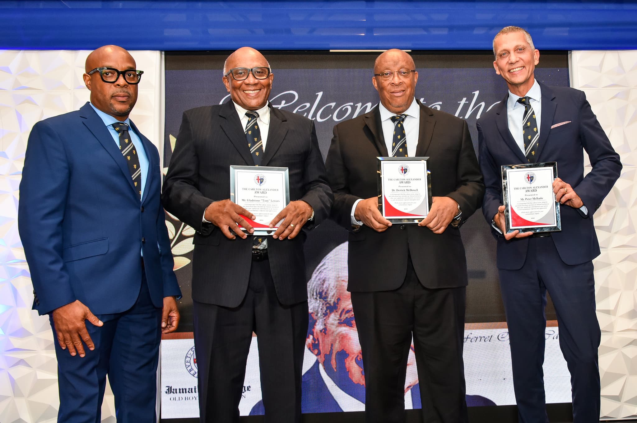 Peter Melhado, Dr. Derrick McDowell, and Gladstone "Tony" Lewars receiving awards